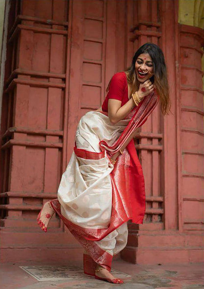 Traditional White Lichi Silk Saree with Bold Red Border and Golden Accents